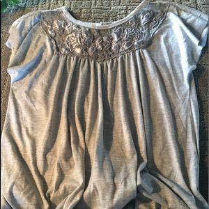 Eye catching gray and silver top.